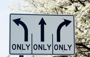 Street sign providing 3 alternatives to travel